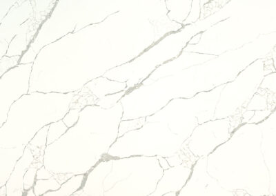 Introducing our latest Quartz masterpiece - a vision of serenity and sophistication. Behold the White with Grey and Beige-Gold Veins Quartz, a harmonious blend of purity and subtle opulence. The pristine white background serves as a canvas for the gentle, graceful veins that gracefully traverse in shades of grey with a touch of beige-gold, adding a subtle warmth and radiance. Immerse yourself in the tranquility of this timeless design, crafted to elevate your space with an understated elegance.